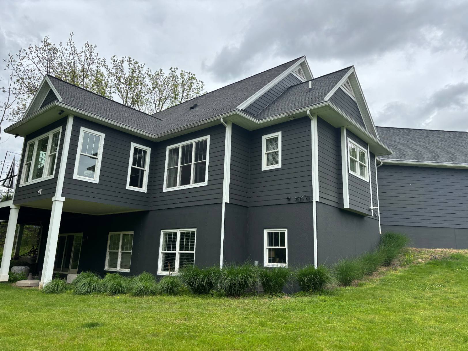 exterior painting on cedar shake home in Rochester eastern suburbs