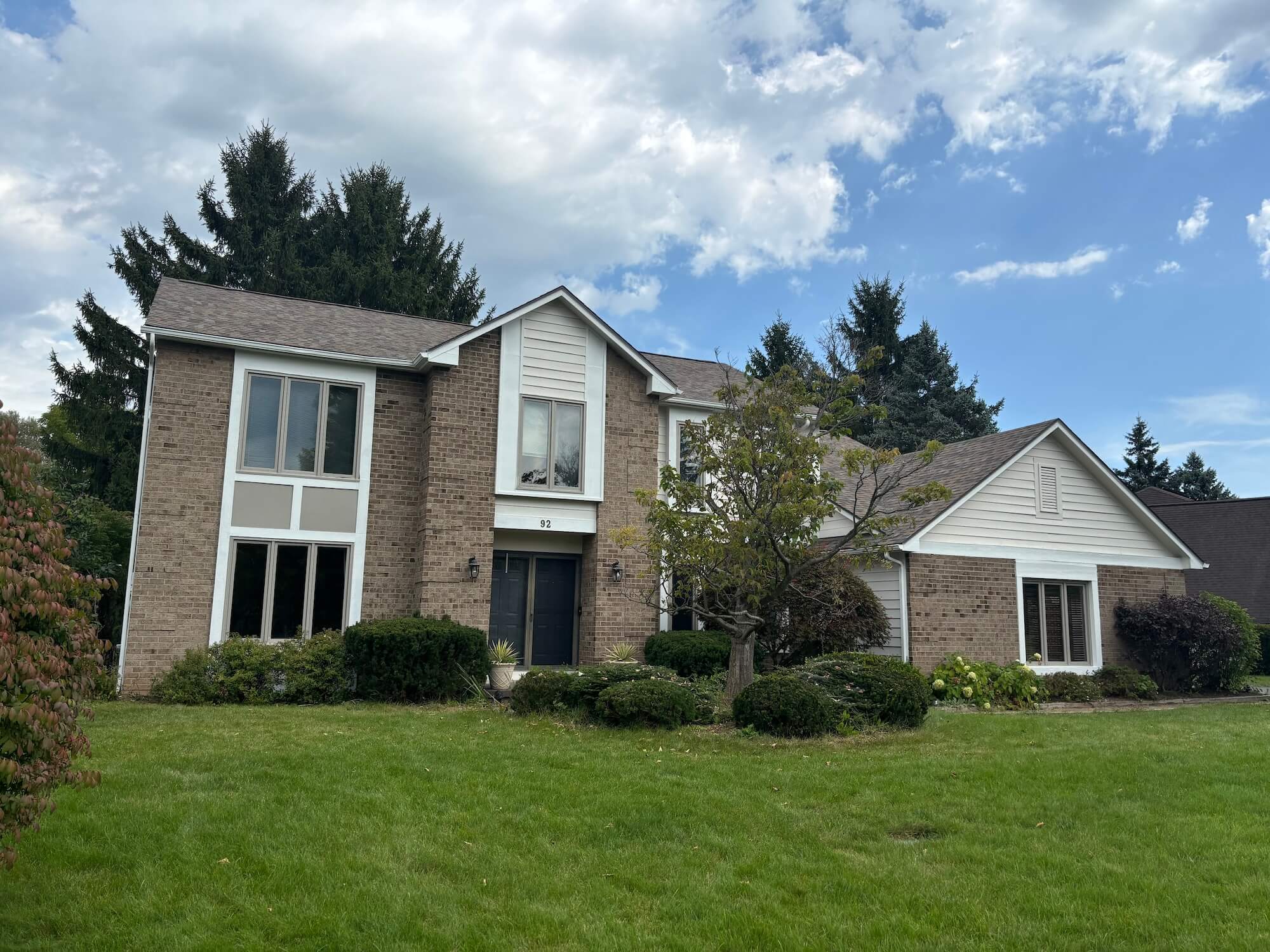 exterior painting on cedar shake home in Rochester eastern suburbs