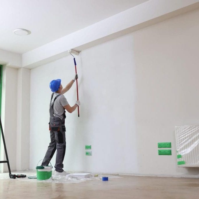 Bates Brothers painter prepping siding on Pittsford area home