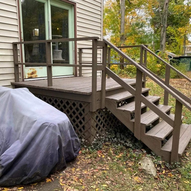 professionally stained wood deck and stairs outside rochester home